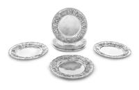 A Set of Eight American Silver Bread Plates, S. Kirk & Son, Baltimore, MD, each having a repousse floral and foliate border, three exam