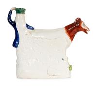 A Collection of Twelve Staffordshire Pottery Figures and Figural Wares