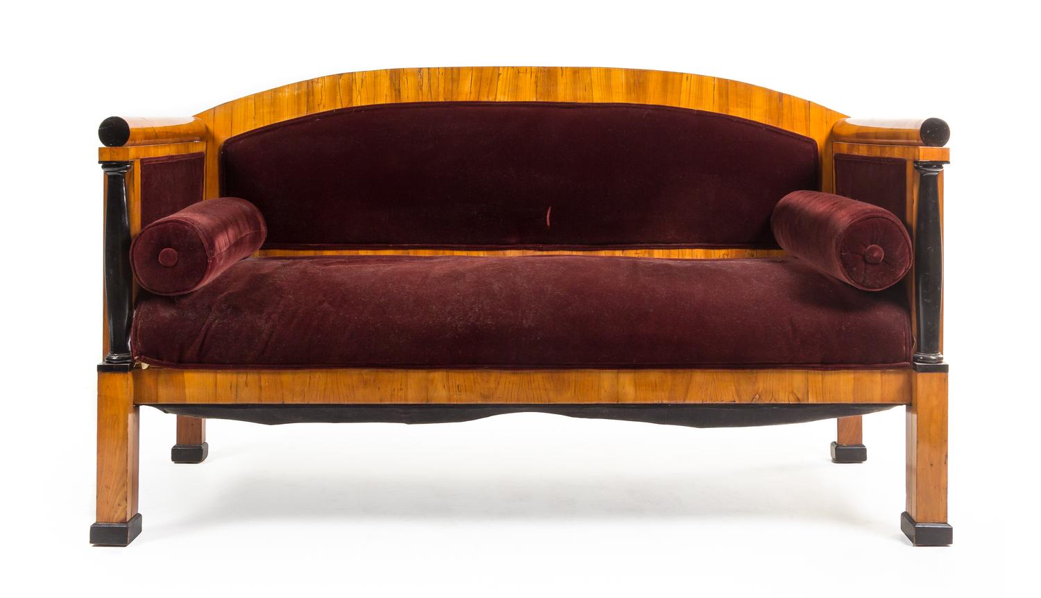 A Biedermeier Parcel Ebonized Birch Sofa Height 39 x width 67 inches. — MANNER OF JOSEF DANHAUSER, MID-19TH CENTURY