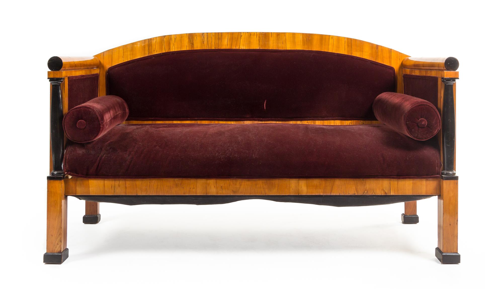 A Biedermeier Parcel Ebonized Birch Sofa Height 39 x width 67 inches. — MANNER OF JOSEF DANHAUSER, MID-19TH CENTURY