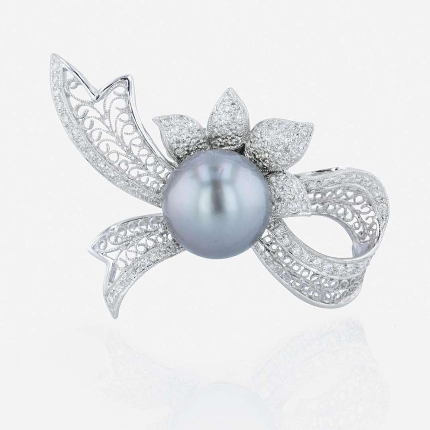 An 18K white gold, Tahitian cultured pearl, and diamond brooch