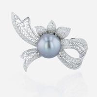 An 18K white gold, Tahitian cultured pearl, and diamond brooch
