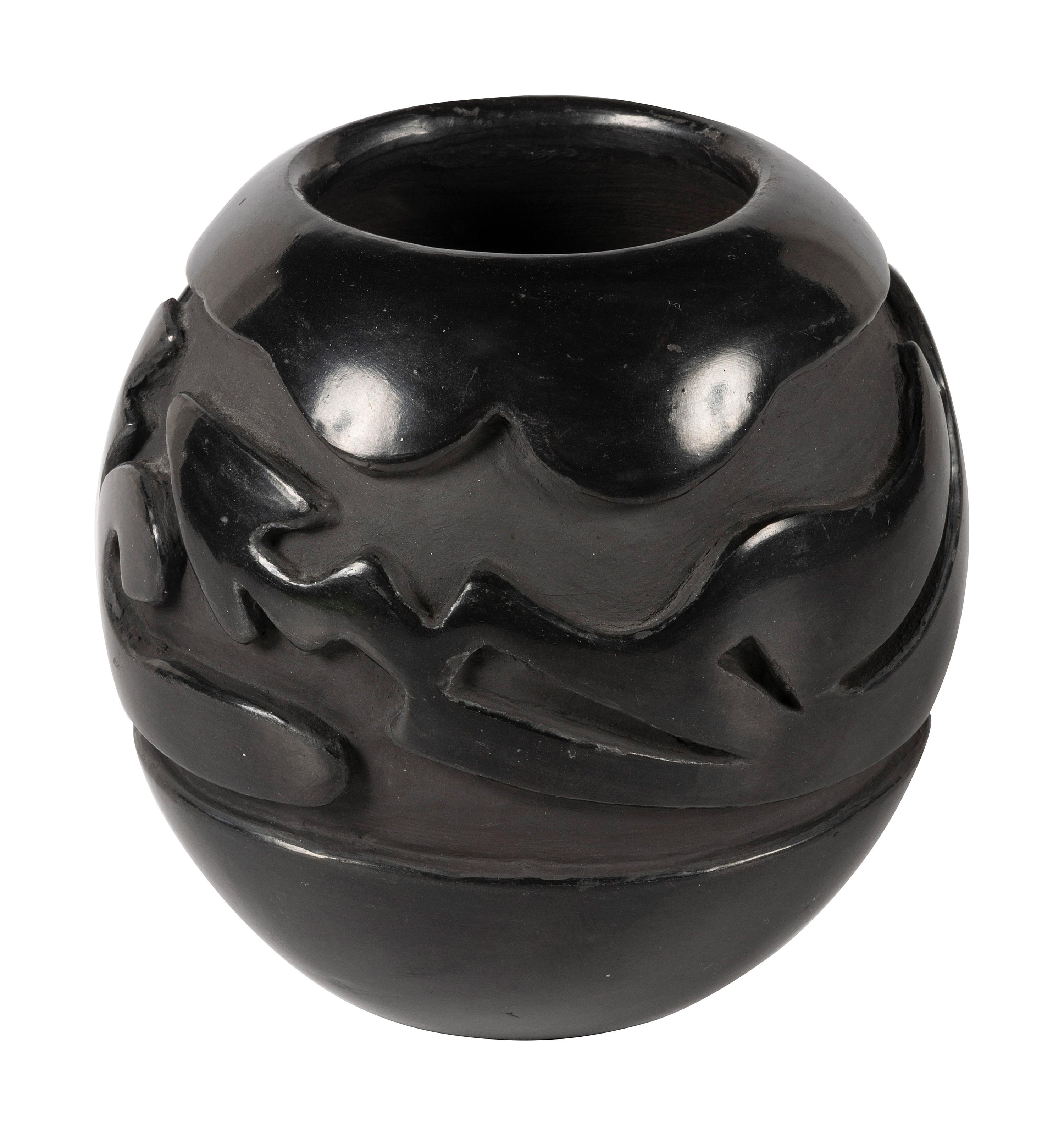 Deeply Carved Blackware Pottery Jar, with Avanyu