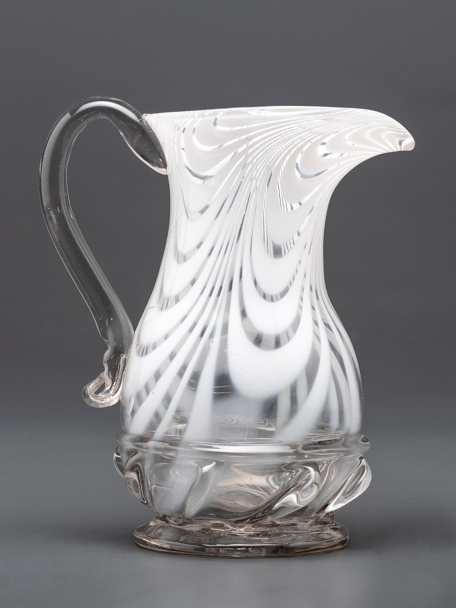 A New Jersey Blown-Glass Pitcher in Clear with White Swirls