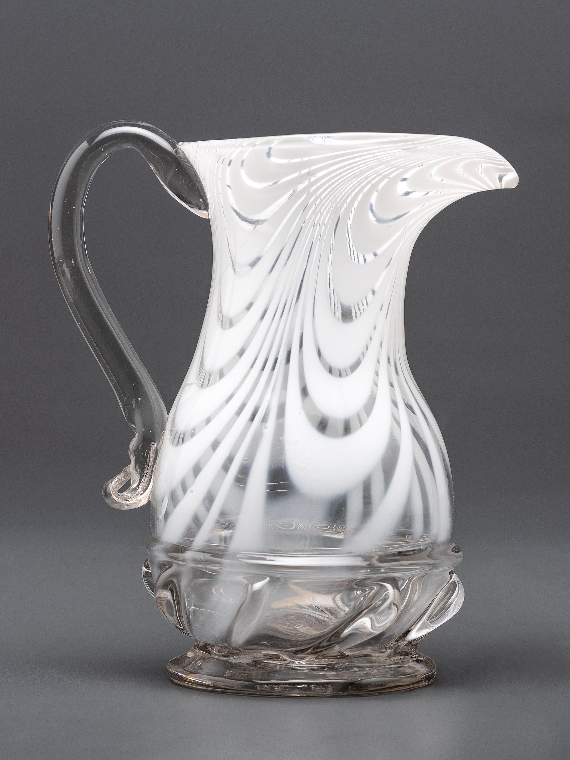 A New Jersey Blown-Glass Pitcher in Clear with White Swirls