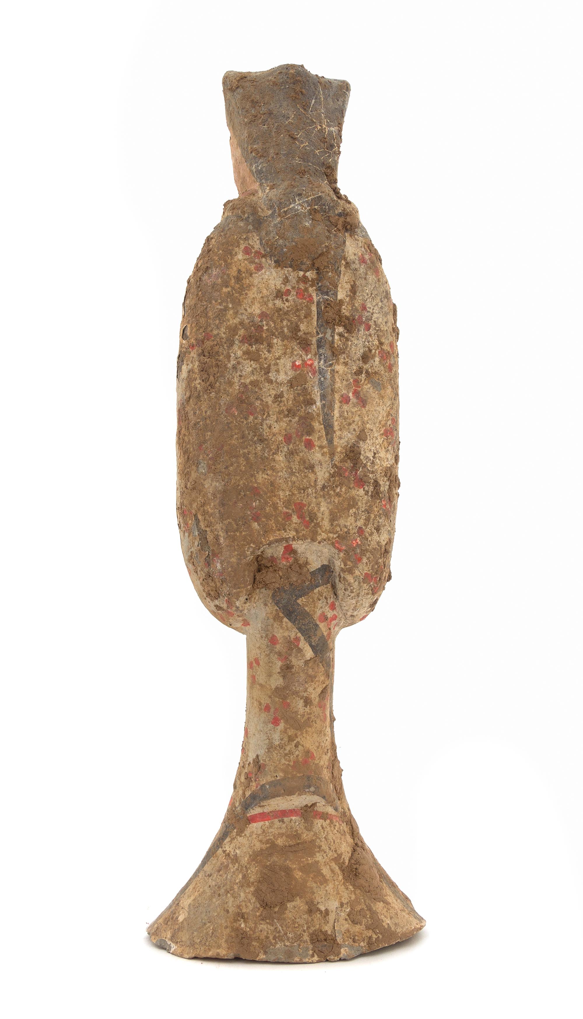 A Chinese Painted Pottery Figure of a Female Attendant Height 17 inches. — HAN DYNASTY (206 B.C. - A.D. 220)