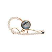 YELLOW GOLD, ESSEX CRYSTAL AND MULTIGEM FISH HOOK BROOCH