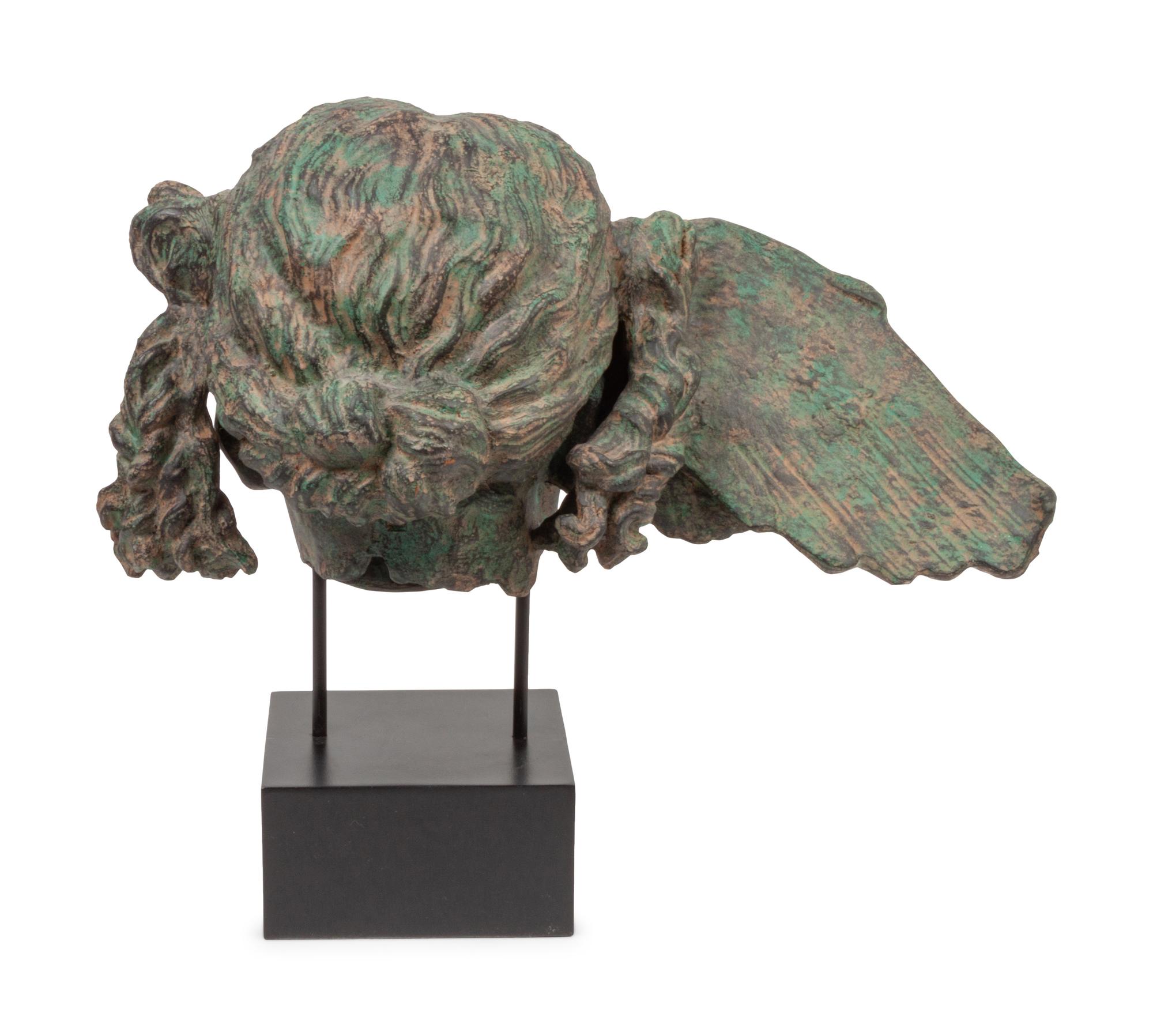 A Patinated Composition Head of Hypnos, After the Antique
