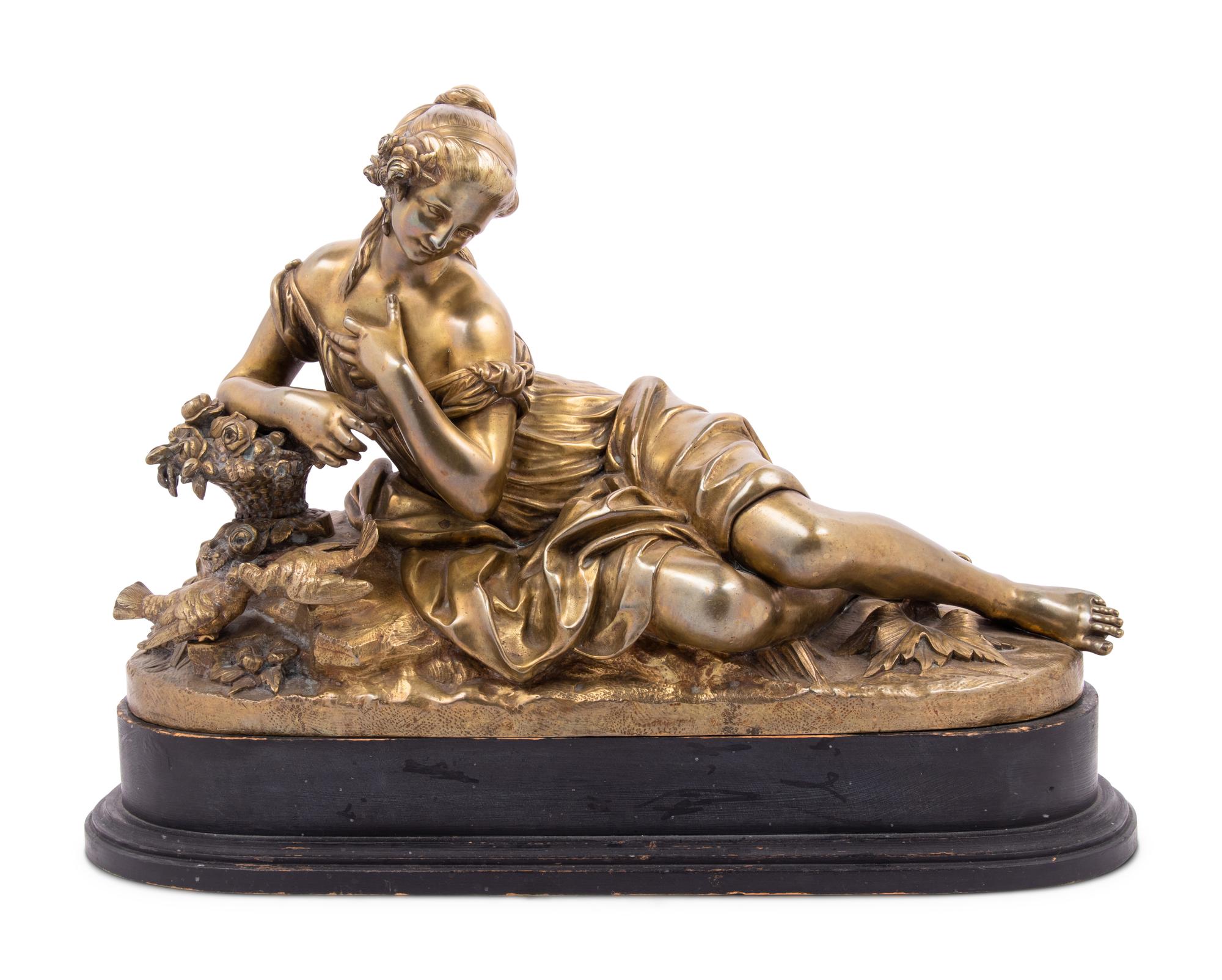 A Gilt Bronze Figure of a Reclining Woman