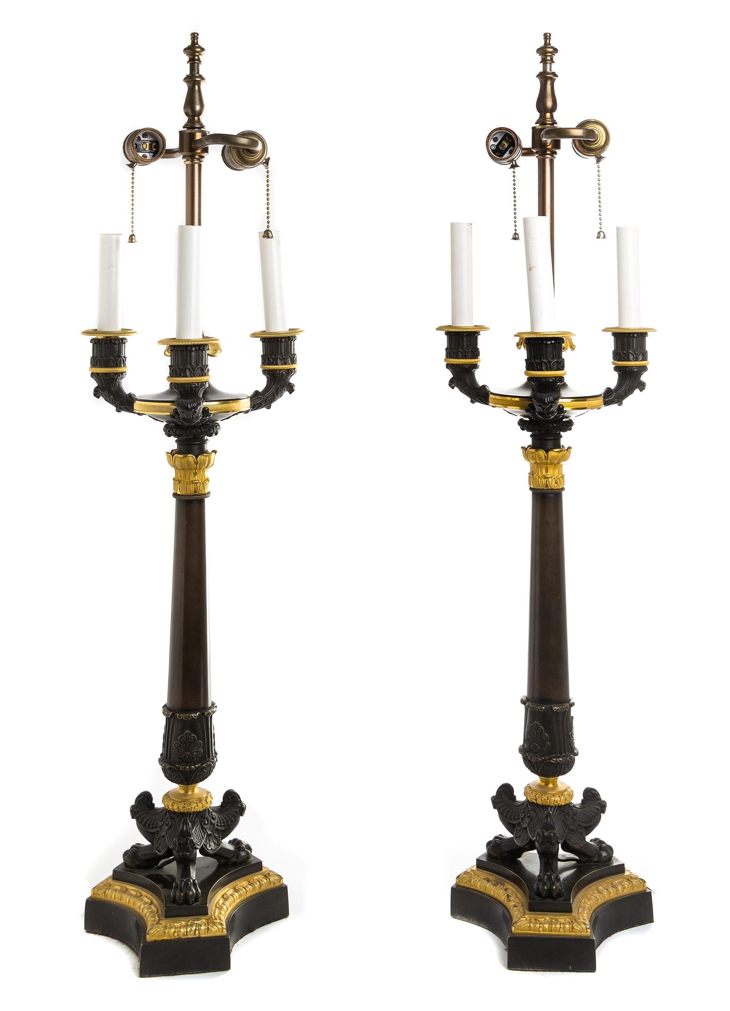A Pair of Louis Philippe Style Patinated and Gilt Bronze Four-Light Candelabra Height overall 35 inches. — 19TH CENTURY