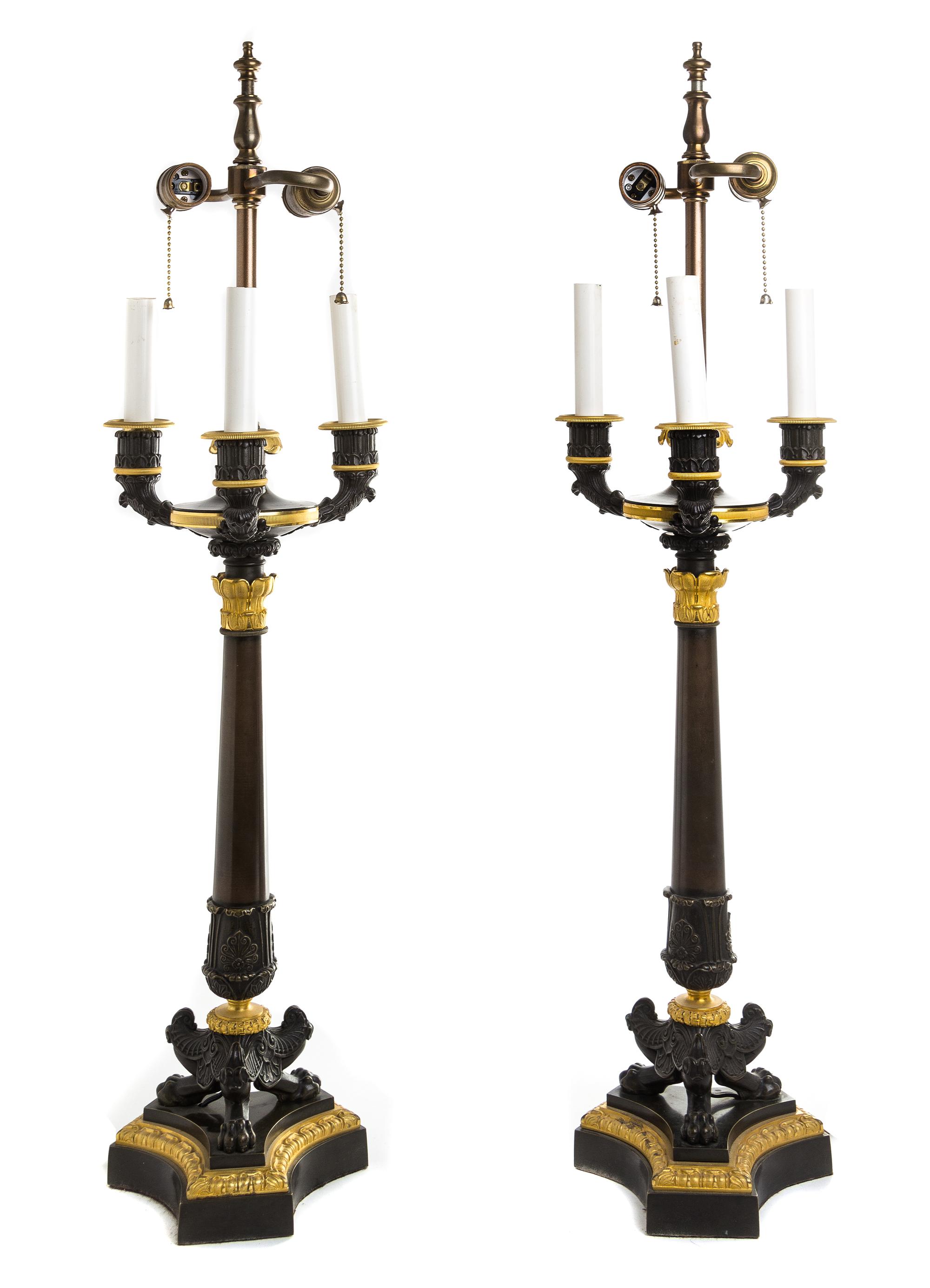 A Pair of Louis Philippe Style Patinated and Gilt Bronze Four-Light Candelabra Height overall 35 inches. — 19TH CENTURY