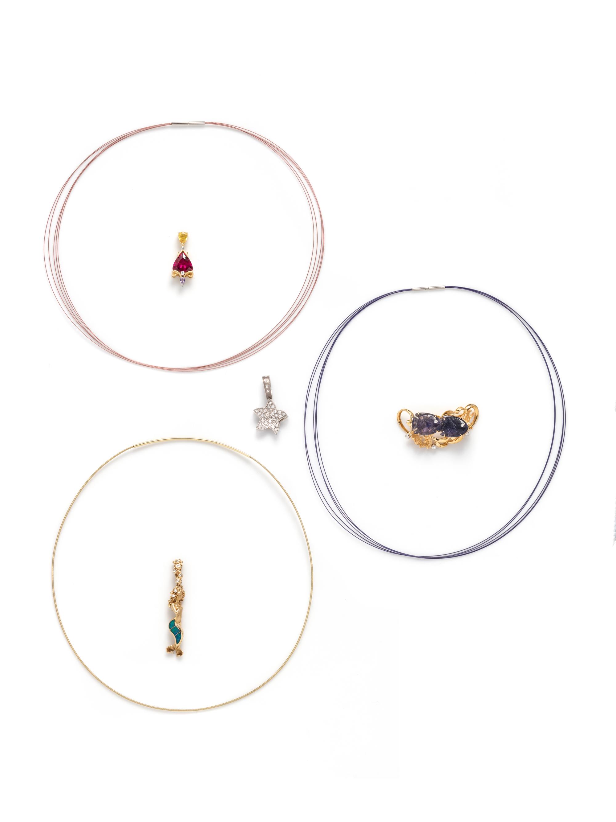 COLLECTION OF WIRE NECKLACES AND SEA MOTIF PENDANTS