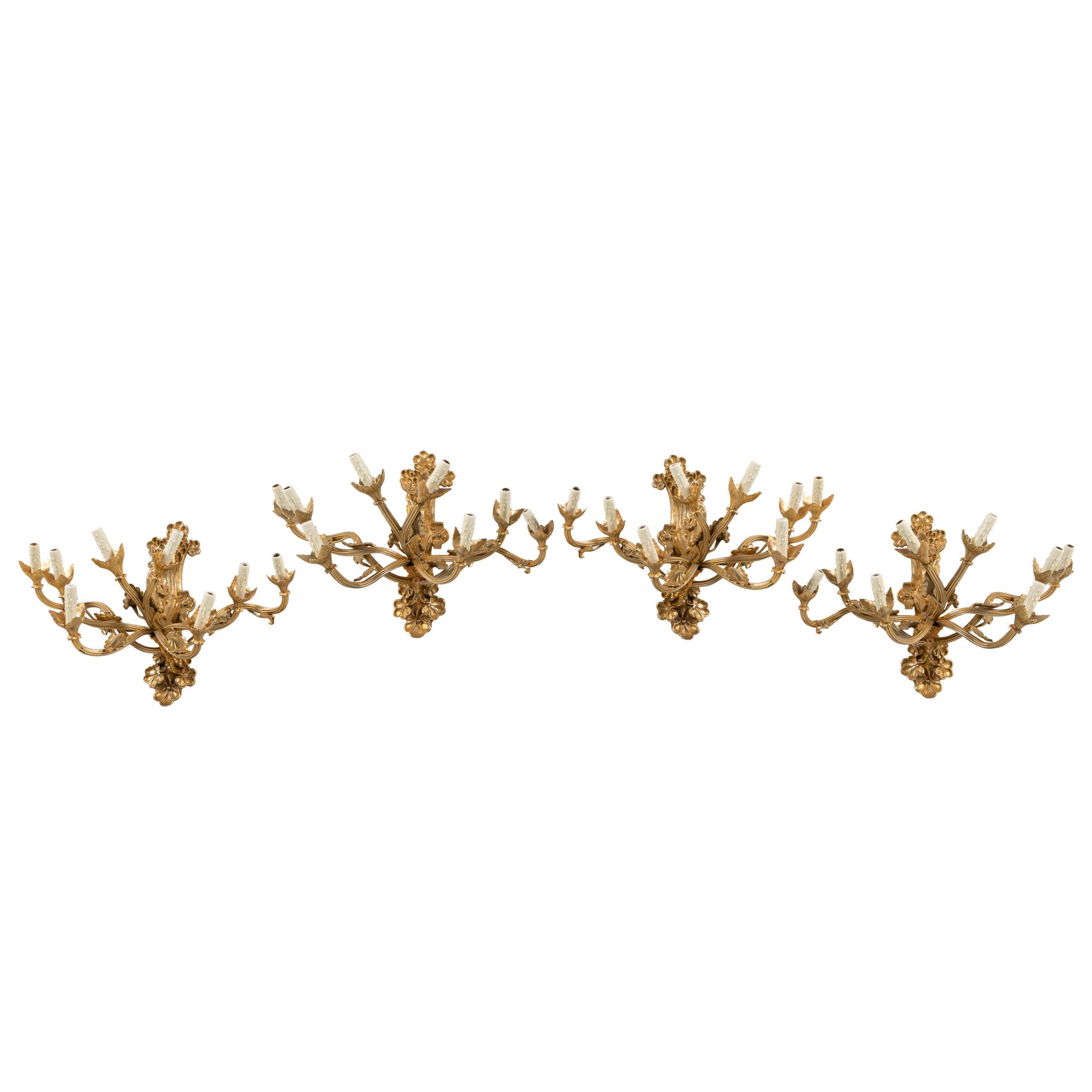 A Set of Four Belle Époque Style Gilt Bronze Eight-Light Sconces