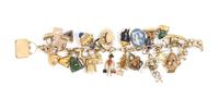 A Yellow Gold Charm Bracelet with 28 Attached Charms, 66.50 dwts.