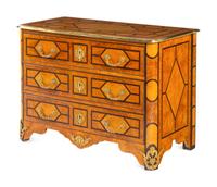 A Régence Style Gilt Metal Mounted Burl Walnut Chest of Drawers