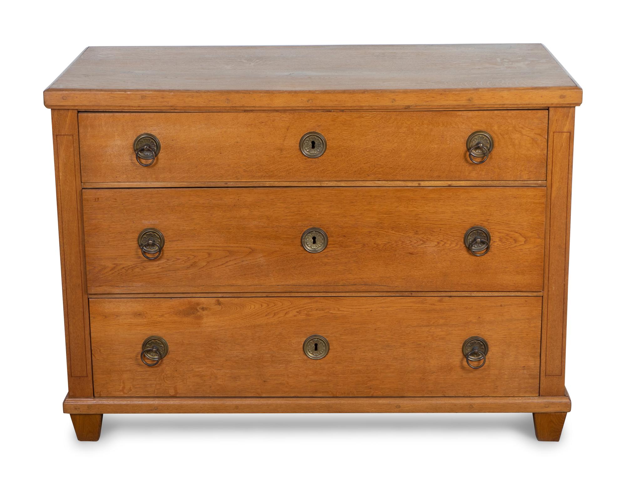 A Continental Neoclassical Style Oak Chest of Drawers — 20TH CENTURY