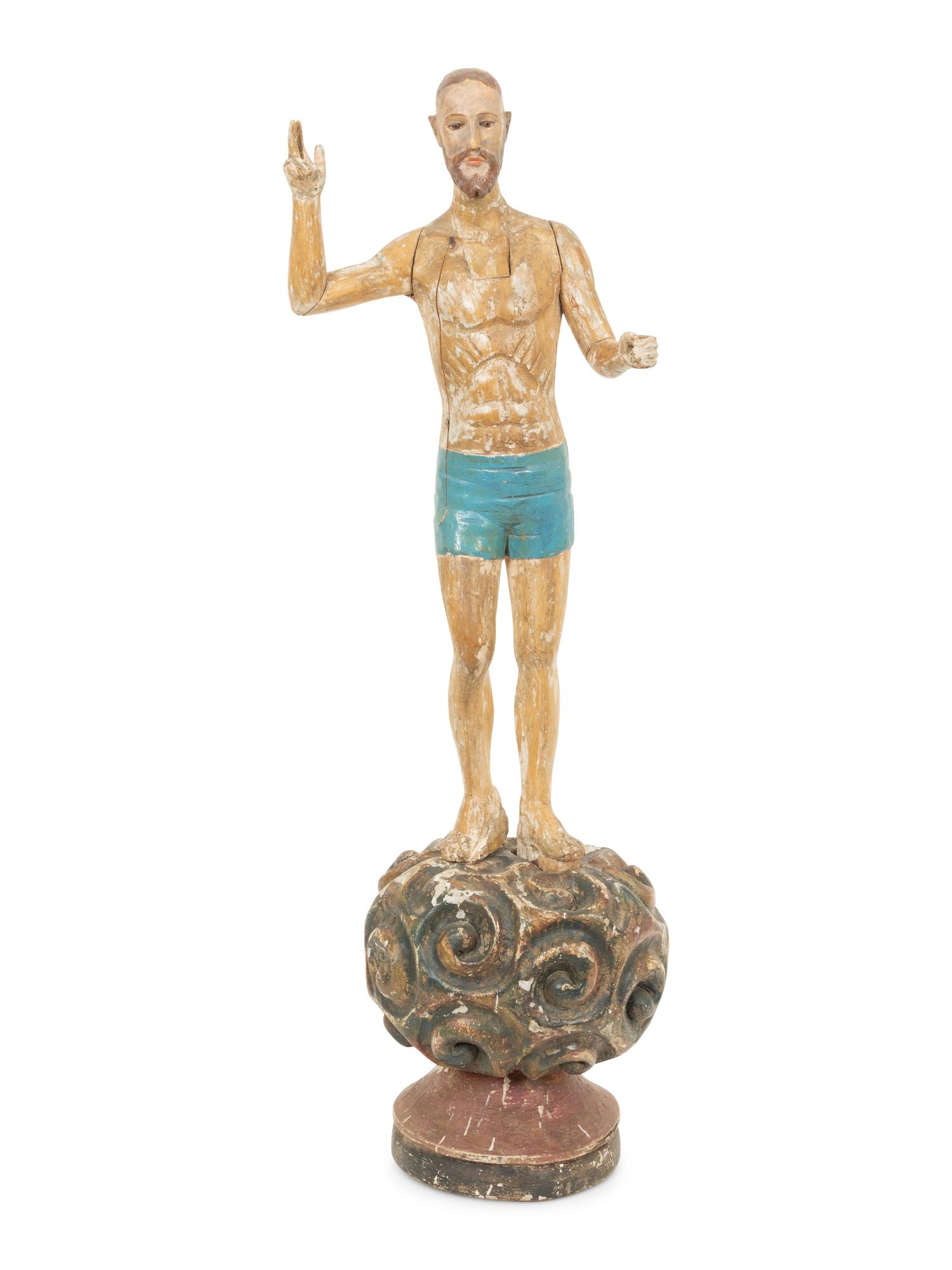 An Italian Carved and Polychromed Giltwood Santos Figure