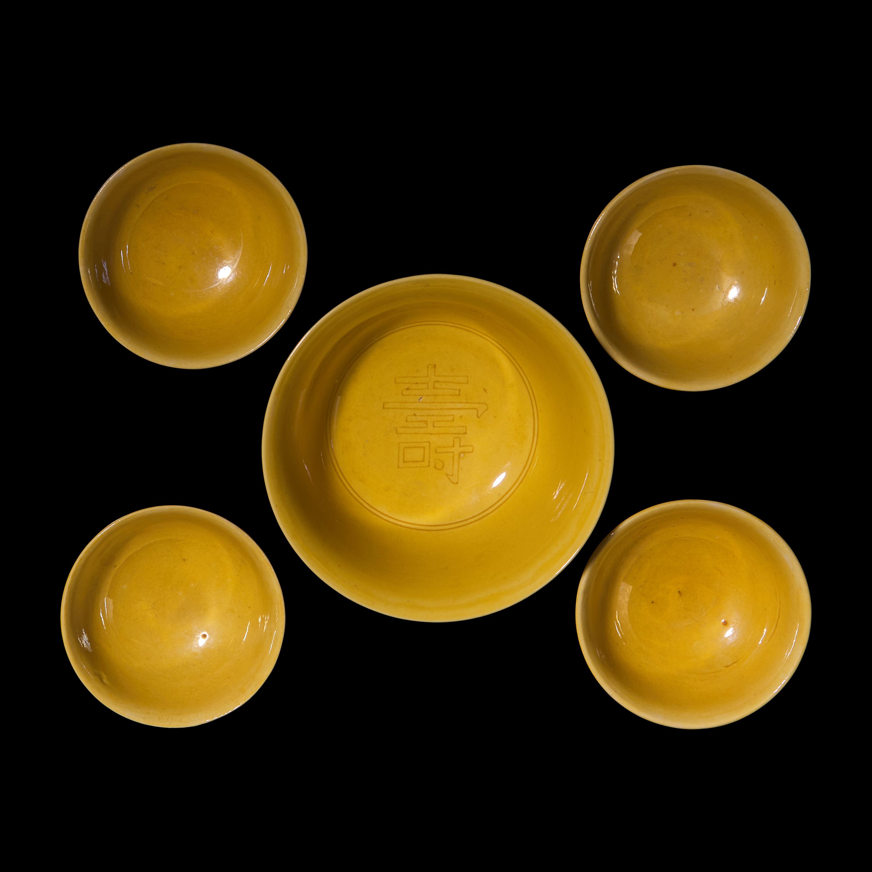 A Group of Five Chinese Incised Yellow Glazed Porcelain "Dragon" Bowls, 19th/20th Century — 清晚期 黃釉暗刻龍紋碗一組五件