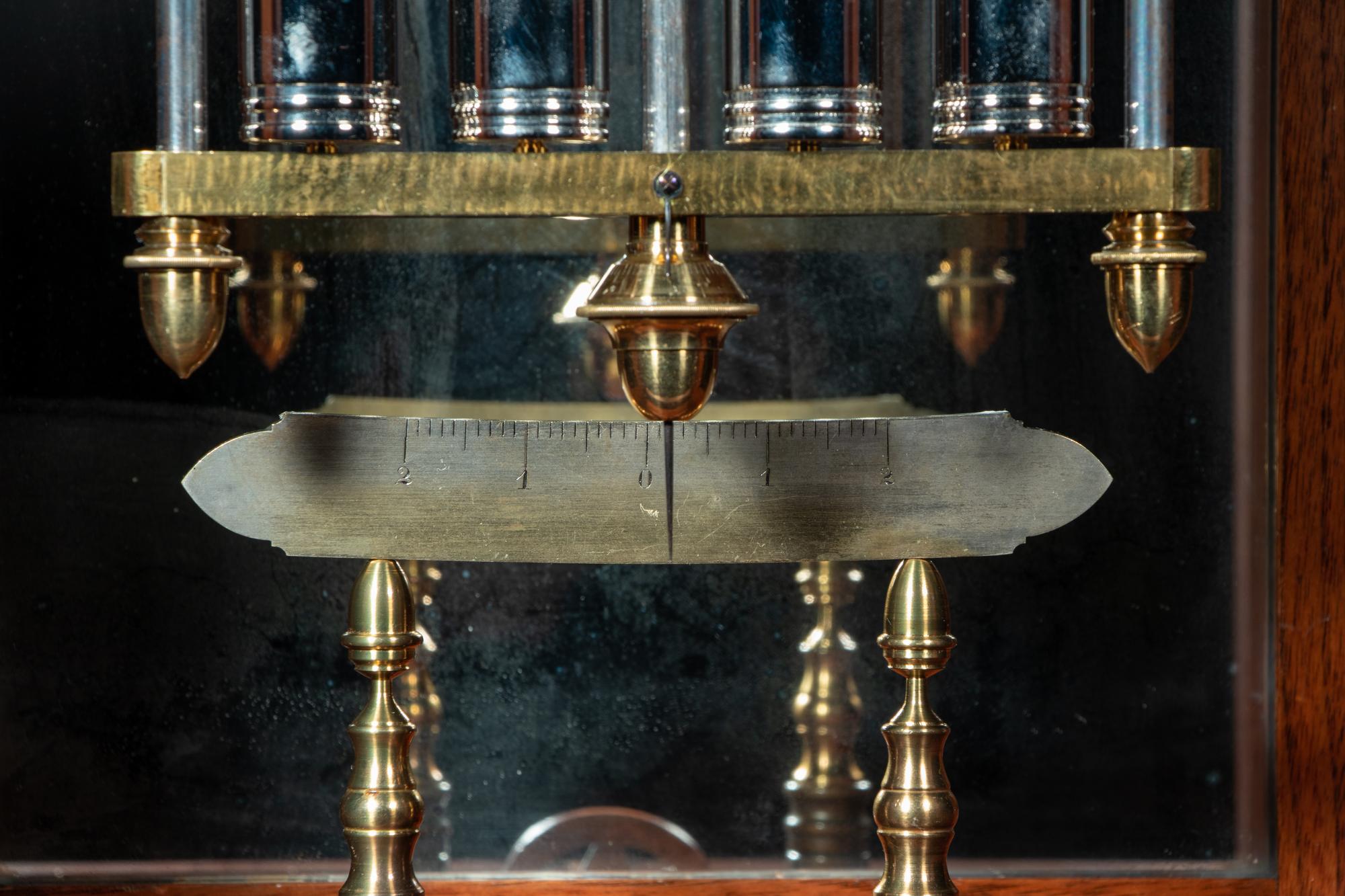 A Gothic Revival Carved Mahogany Tall Case No. 24 Astronomical Regulator