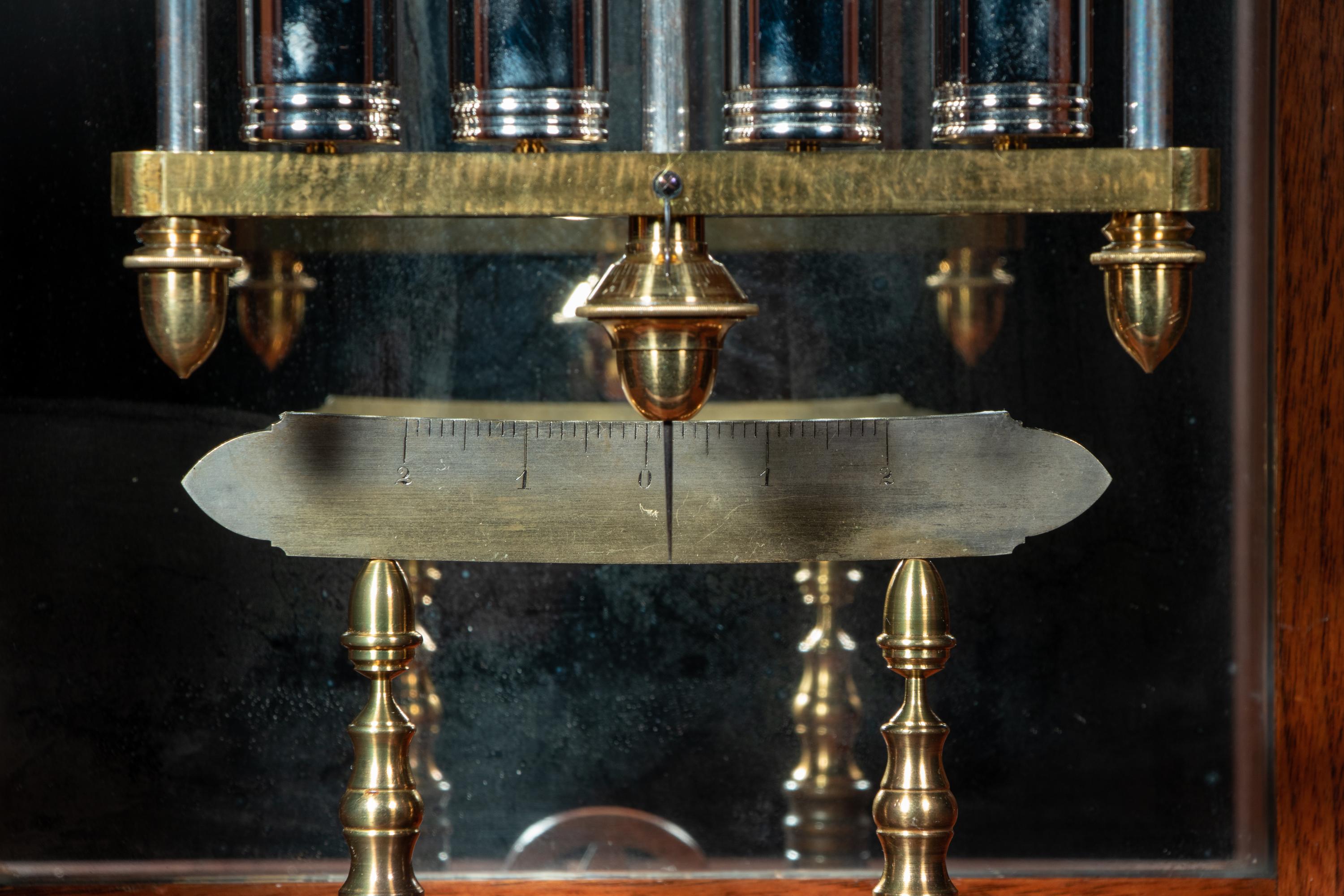 A Gothic Revival Carved Mahogany Tall Case No. 24 Astronomical Regulator