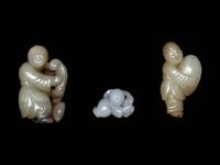 Three Chinese Celadon and White Jade Carved Figures of Boys
