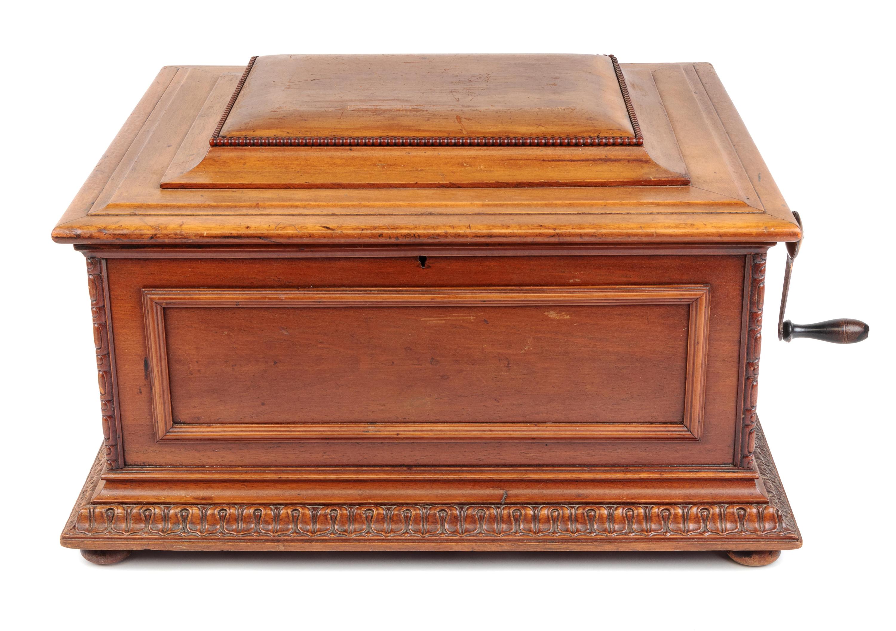 A Regina 15 1/2-Inch Double-Comb Disk Oak Music Box