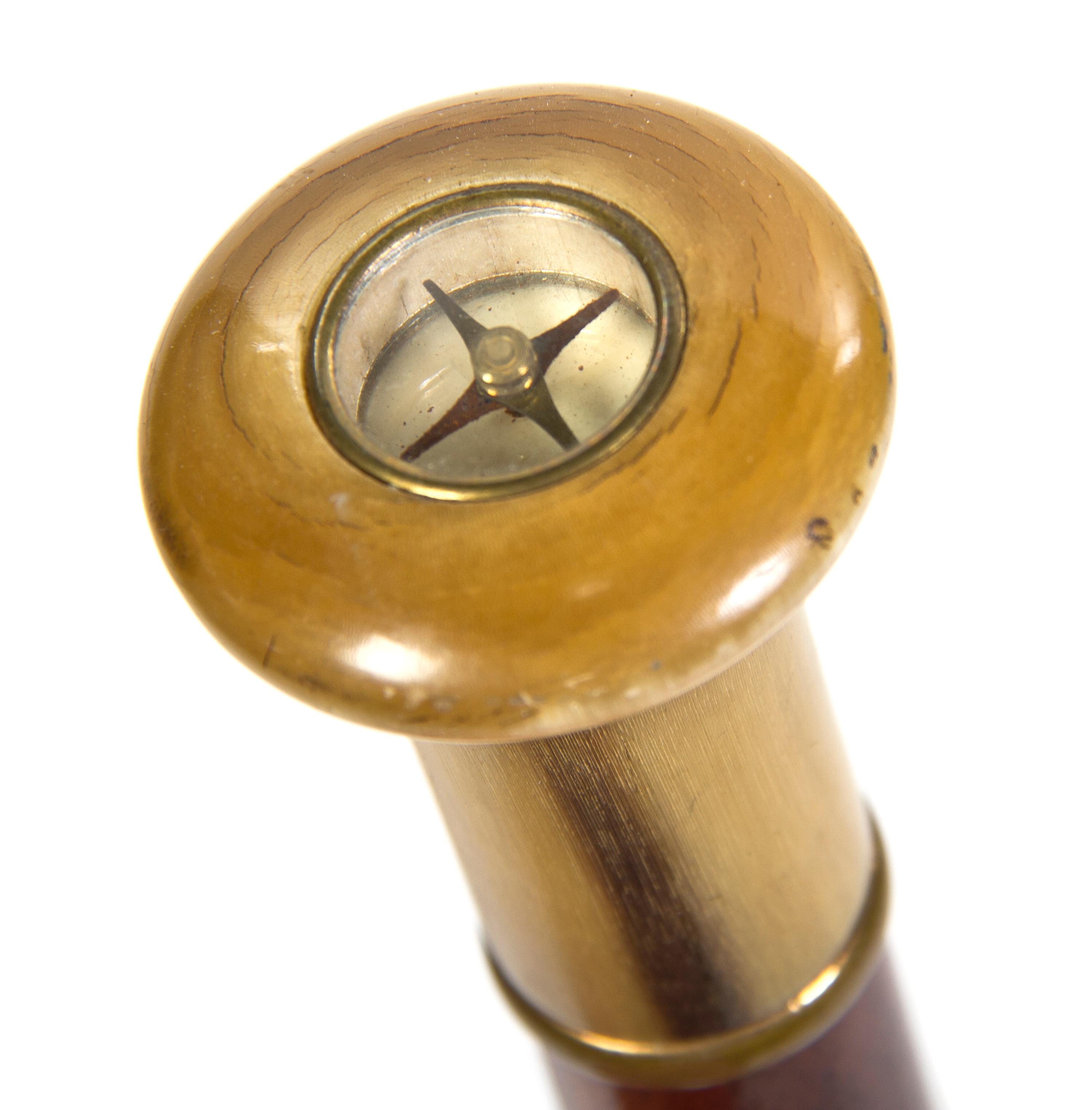 A Compass Inset Horn and Mahogany Walking Stick, Height overall 35 1/2 inches x diameter of handle 1 3/8 inches.