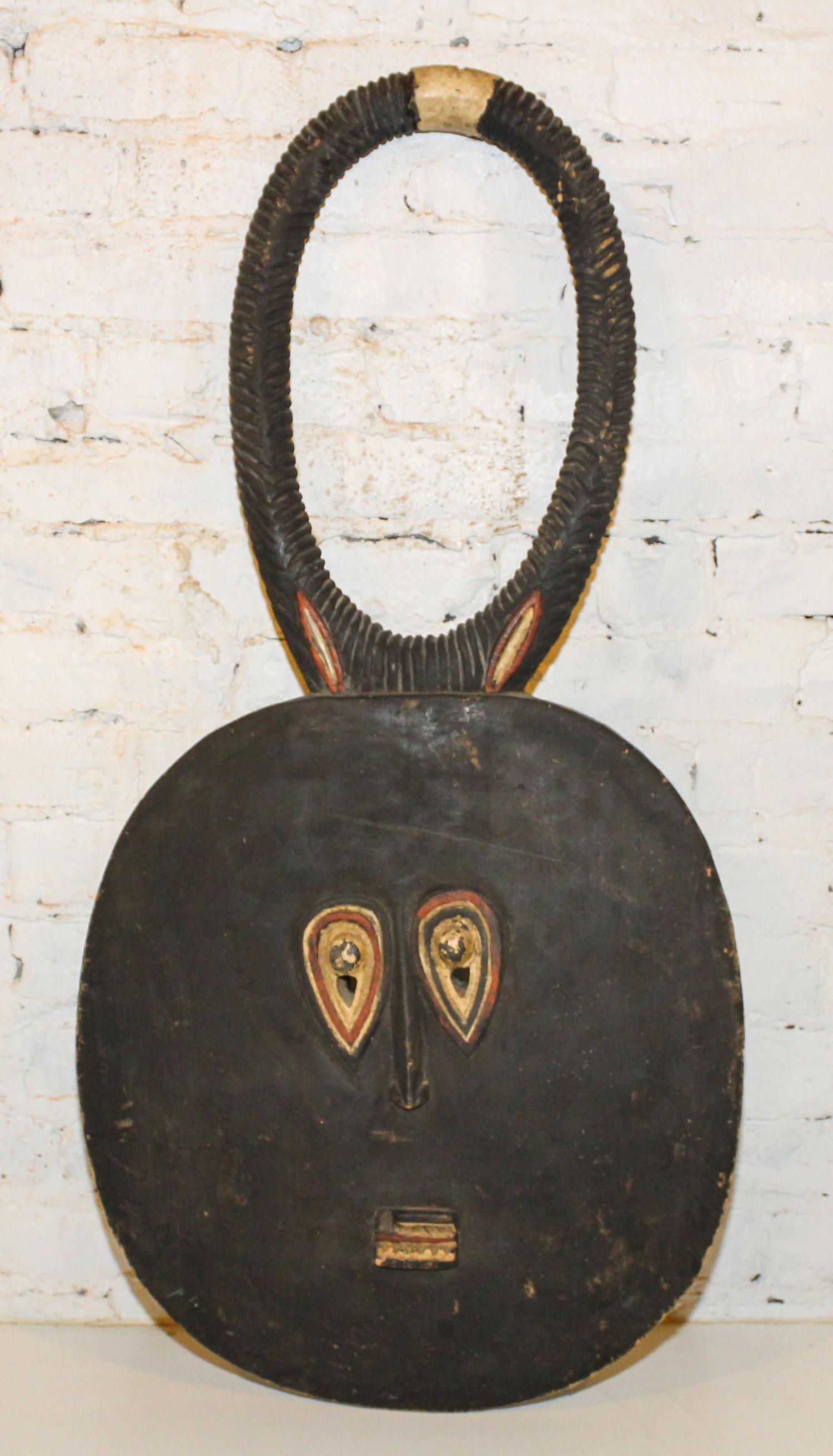 A Baule Style Mask. Length 39 inches.