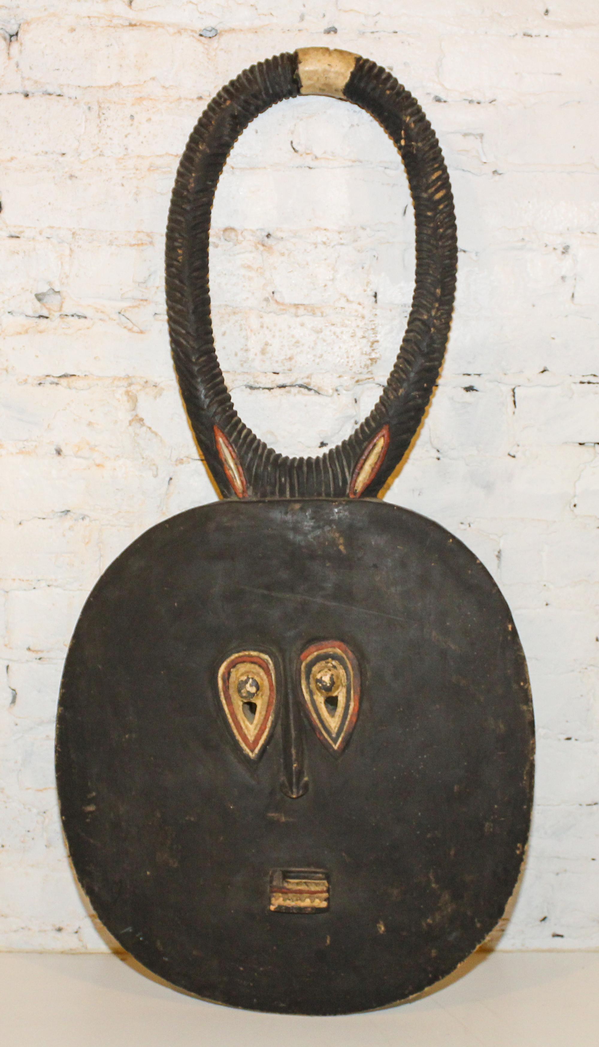 A Baule Style Mask. Length 39 inches.