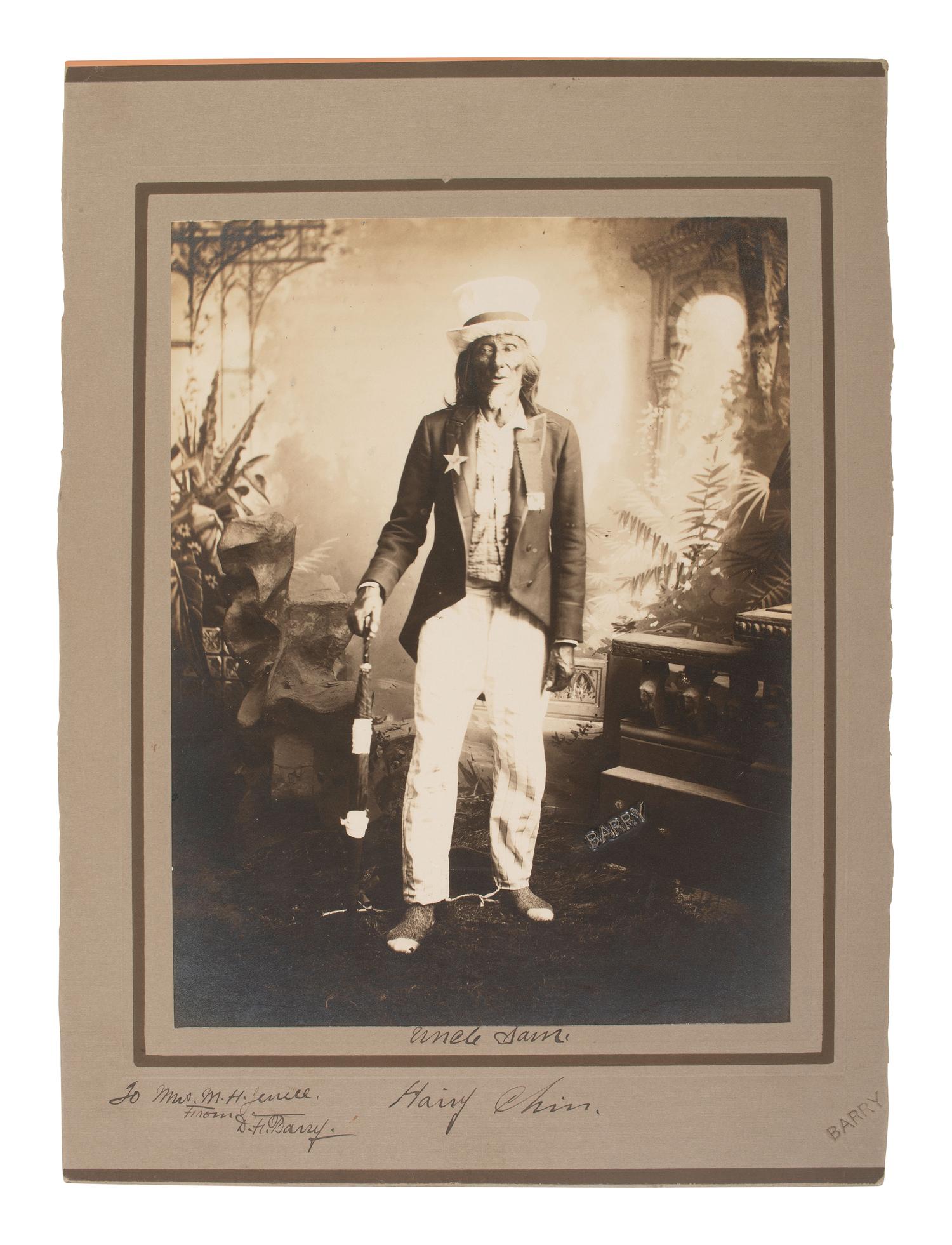 BARRY, David F. (1854-1934), photographer. Portrait of Hairy Chin, Sioux, dressed as Uncle Sam, signed and inscribed by Barry.