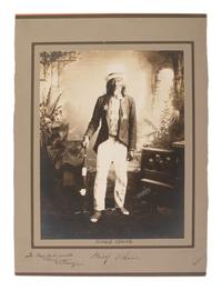 BARRY, David F. (1854-1934), photographer. Portrait of Hairy Chin, Sioux, dressed as Uncle Sam, signed and inscribed by Barry.