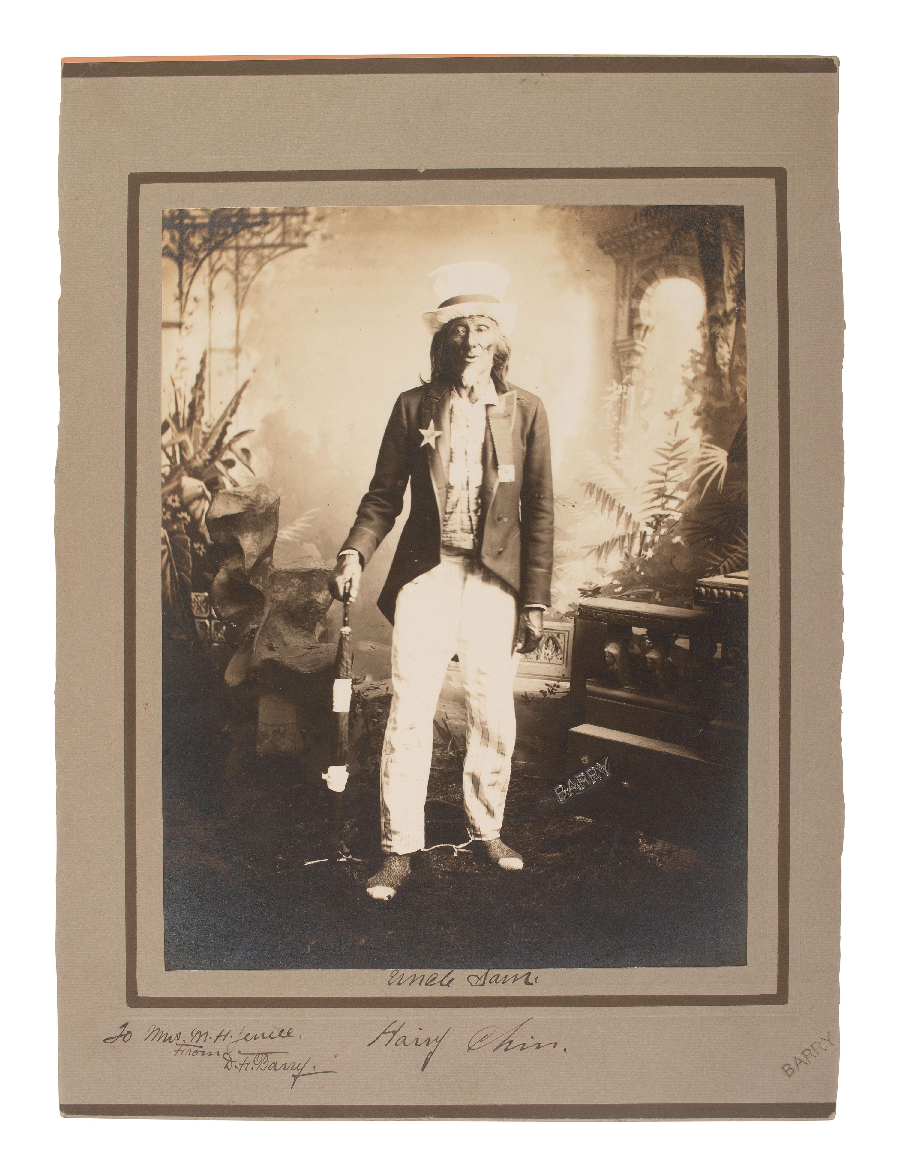 BARRY, David F. (1854-1934), photographer. Portrait of Hairy Chin, Sioux, dressed as Uncle Sam, signed and inscribed by Barry.