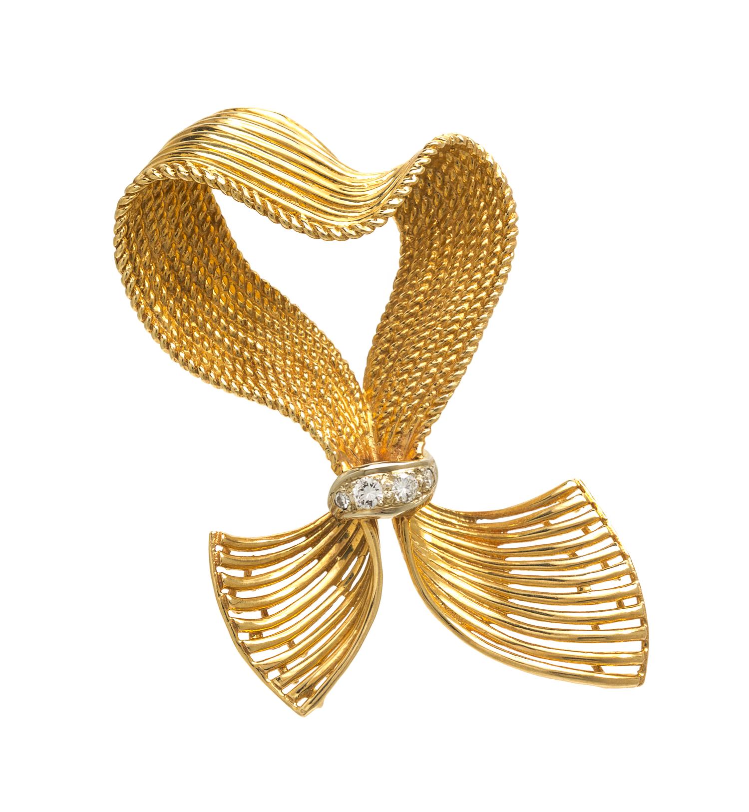 A 14 Karat Yellow Gold and Diamond Ribbon Motif Brooch, 8.10 dwts.