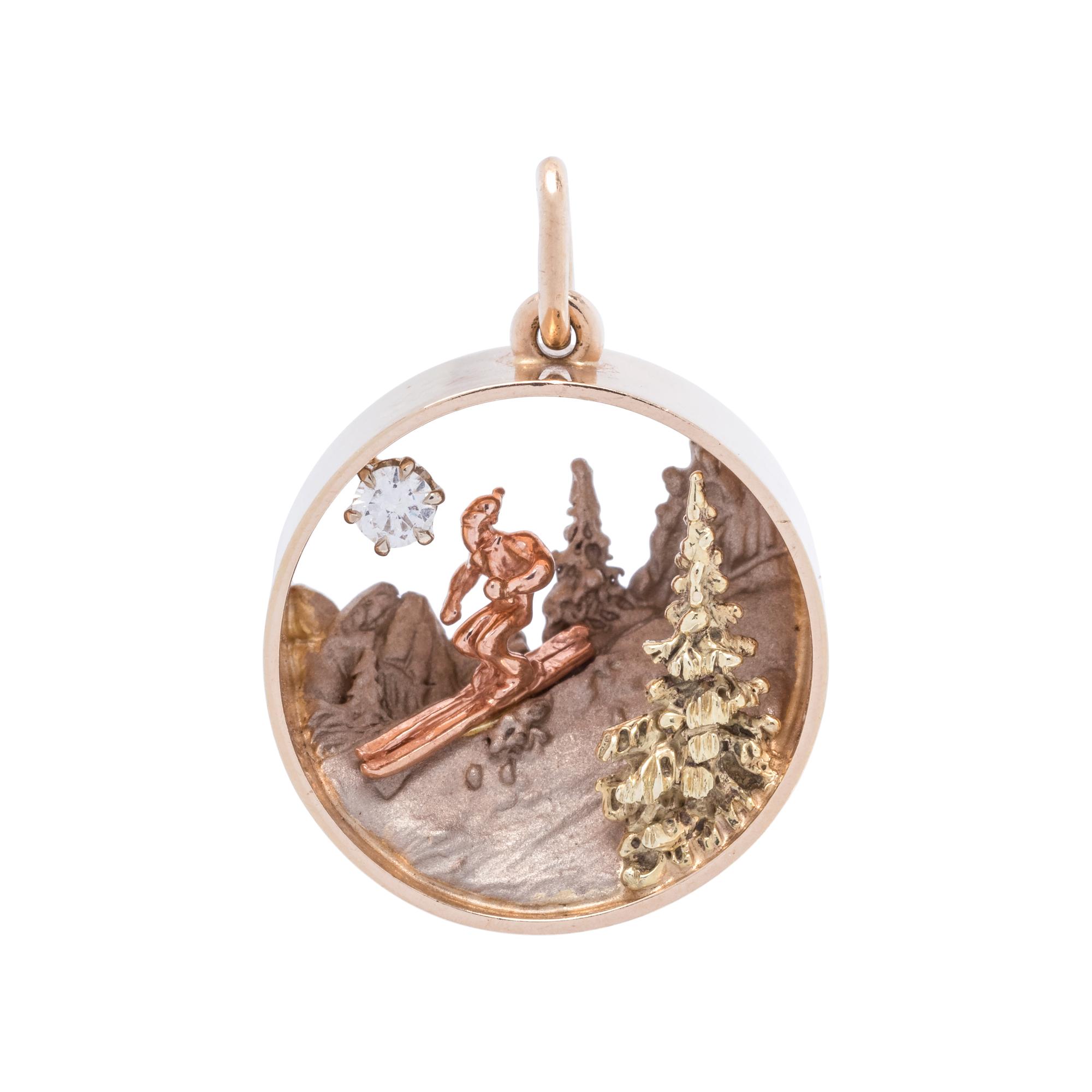 BRYSON, GOLD AND DIAMOND SKIER PENDANT
