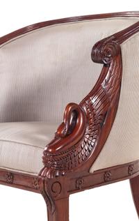 A Pair of Empire Style Carved Mahogany Swan's Neck Barrel Back Armchairs
