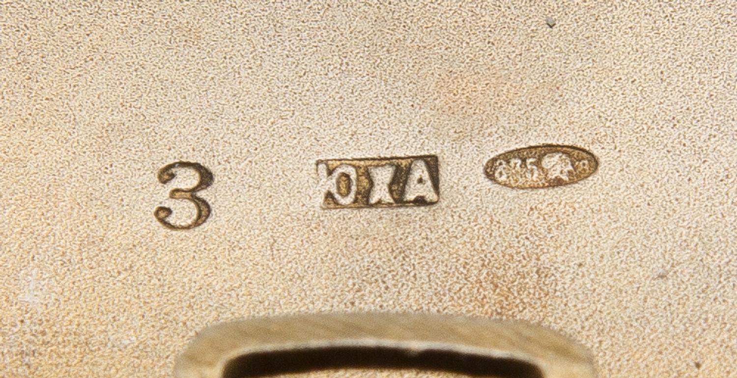 A Soviet-Era Russian Silver Cigarette Case, Mark of the Jeweller Art Artel, Moscow, Mid-20th Century, the lid worked to show a hammer a
