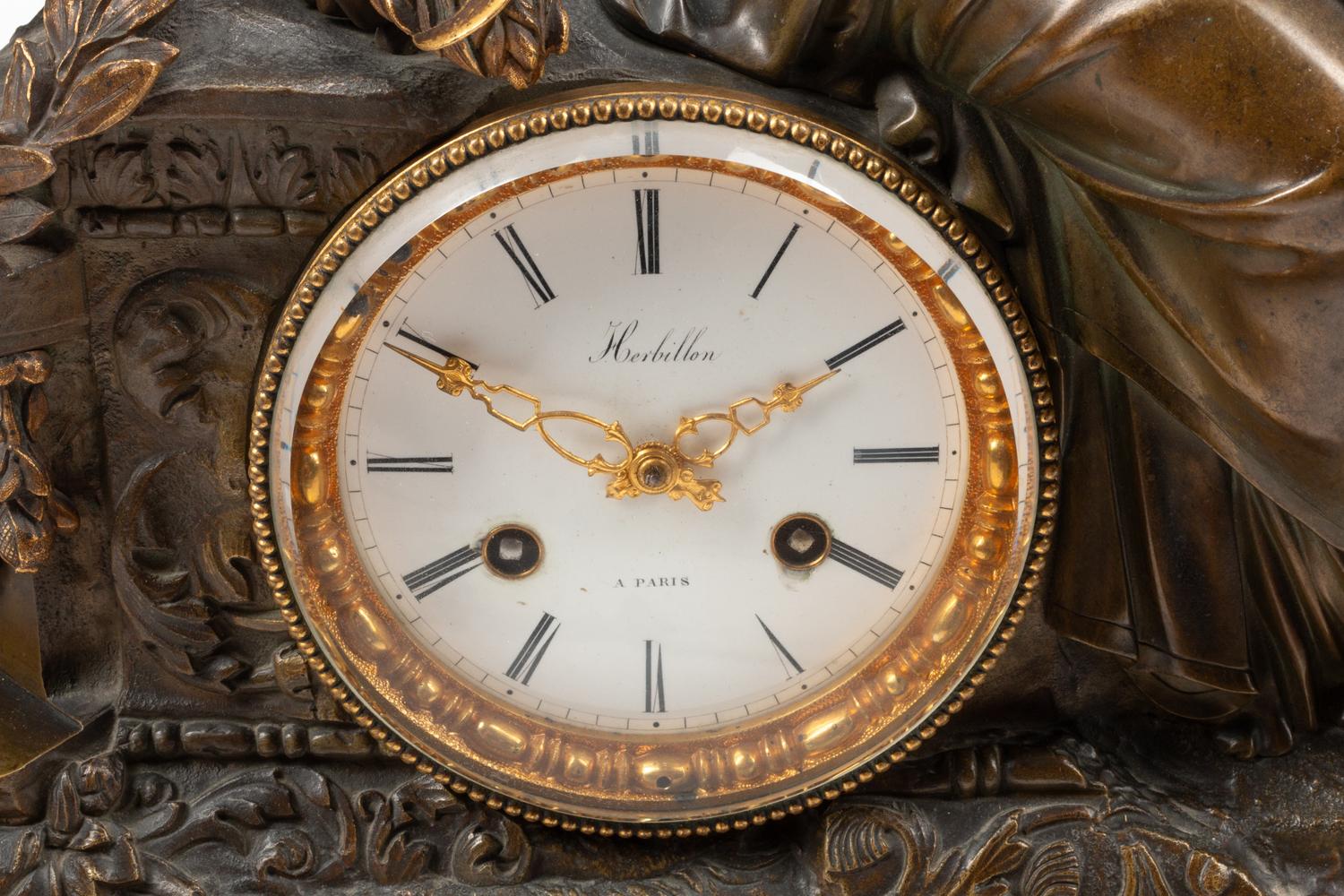 A French Bronze and Slate Figural Mantel Clock