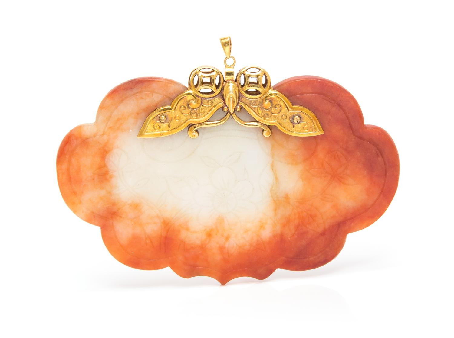 A 14 Karat Yellow Gold and Jade Pendant, 42.10 dwts.