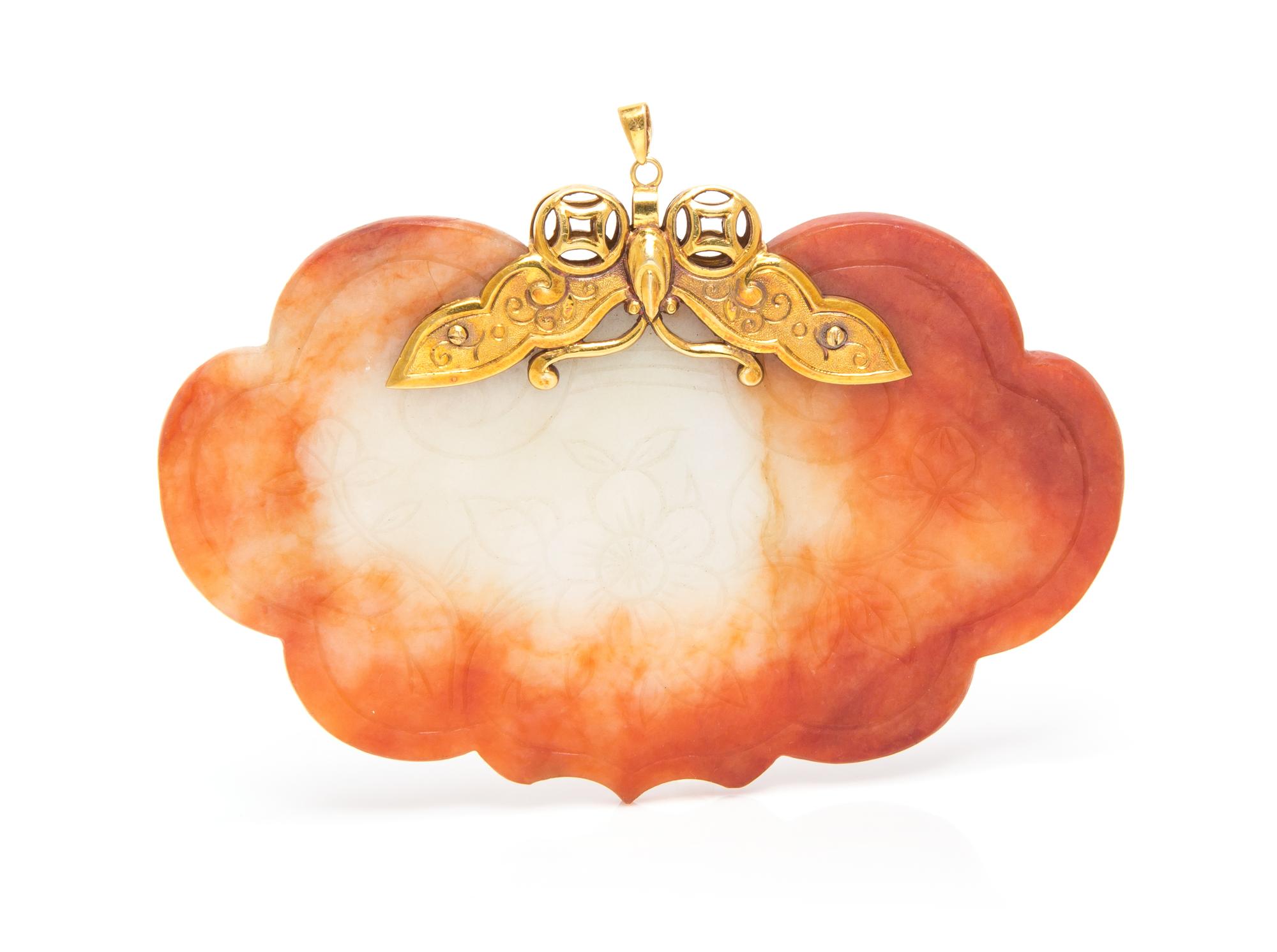 A 14 Karat Yellow Gold and Jade Pendant, 42.10 dwts.