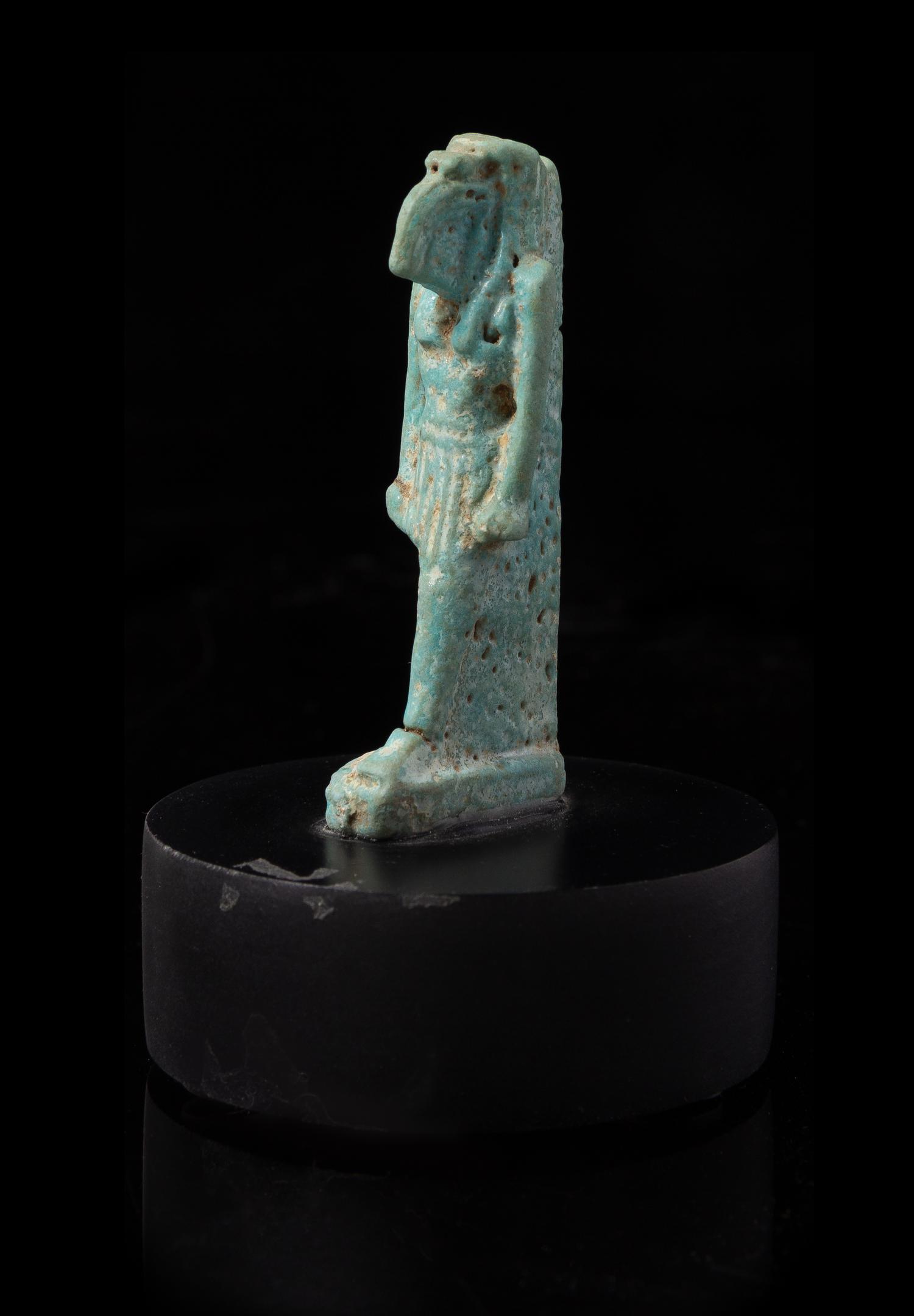 An Egyptian Faience Amulet of Thoth Height 2 1/8 inches. — PTOLEMAIC PERIOD, 304-30 B.C.E.