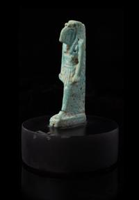 An Egyptian Faience Amulet of Thoth Height 2 1/8 inches. — PTOLEMAIC PERIOD, 304-30 B.C.E.