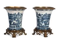 A Pair of United Wilson Gilt Metal Mounted Canton Style Porcelain Urns
