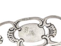 A Set of Fifteen German Silver Napkin Rings