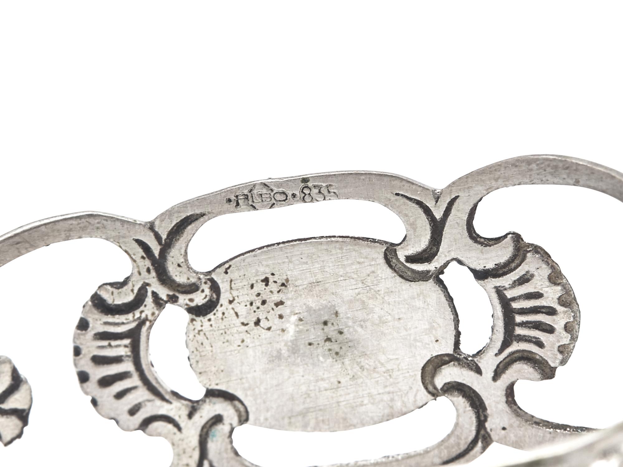 A Set of Fifteen German Silver Napkin Rings