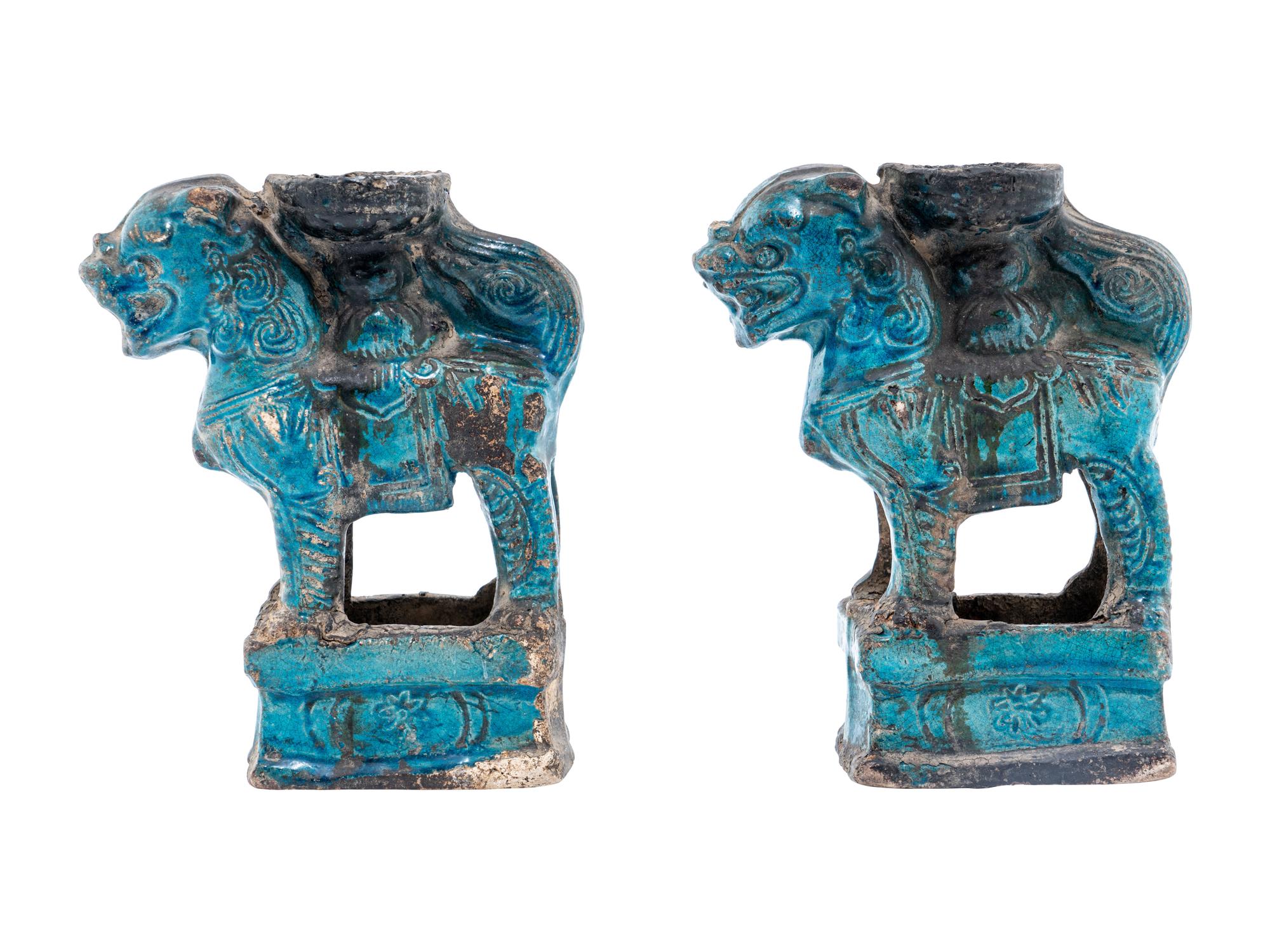 A Pair of Chinese Turquoise Glazed Pottery Fu Lion-Form Candle Holders