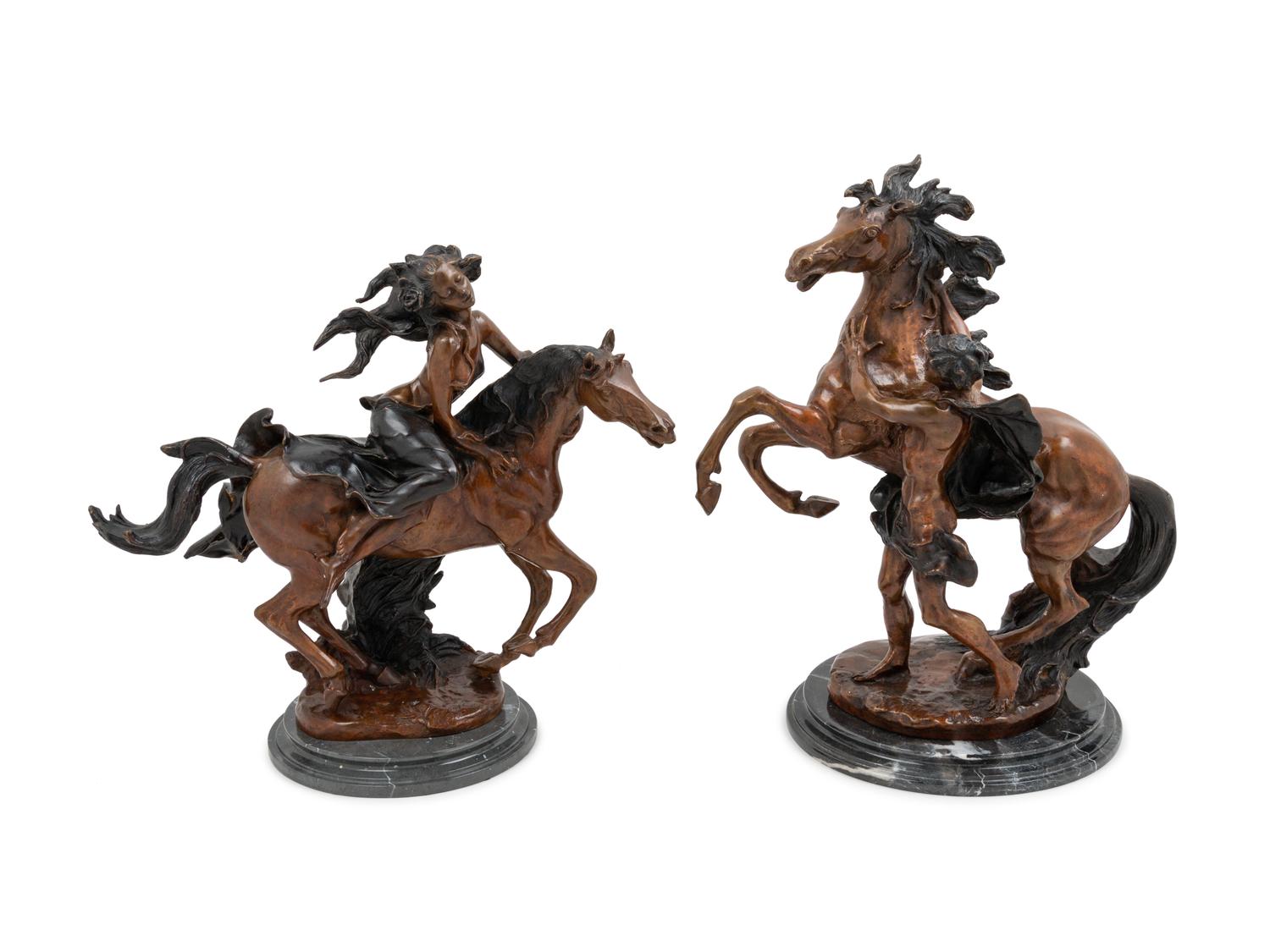 A Pair of Patinated Bronze Figural Groups