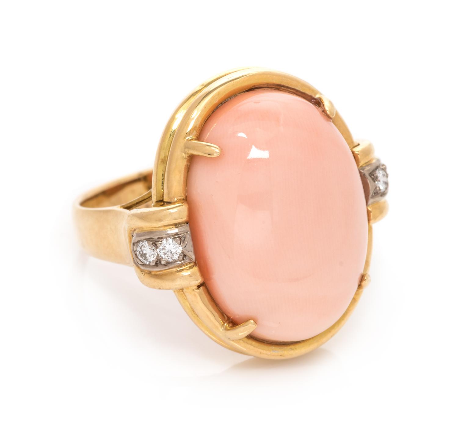 An 18 Karat Bicolor Gold, Angel Skin Coral and Diamond Ring, 7.80 dwts.