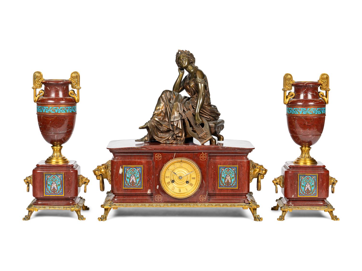 A French Bronze, Marble and Champlevé Clock Garniture
