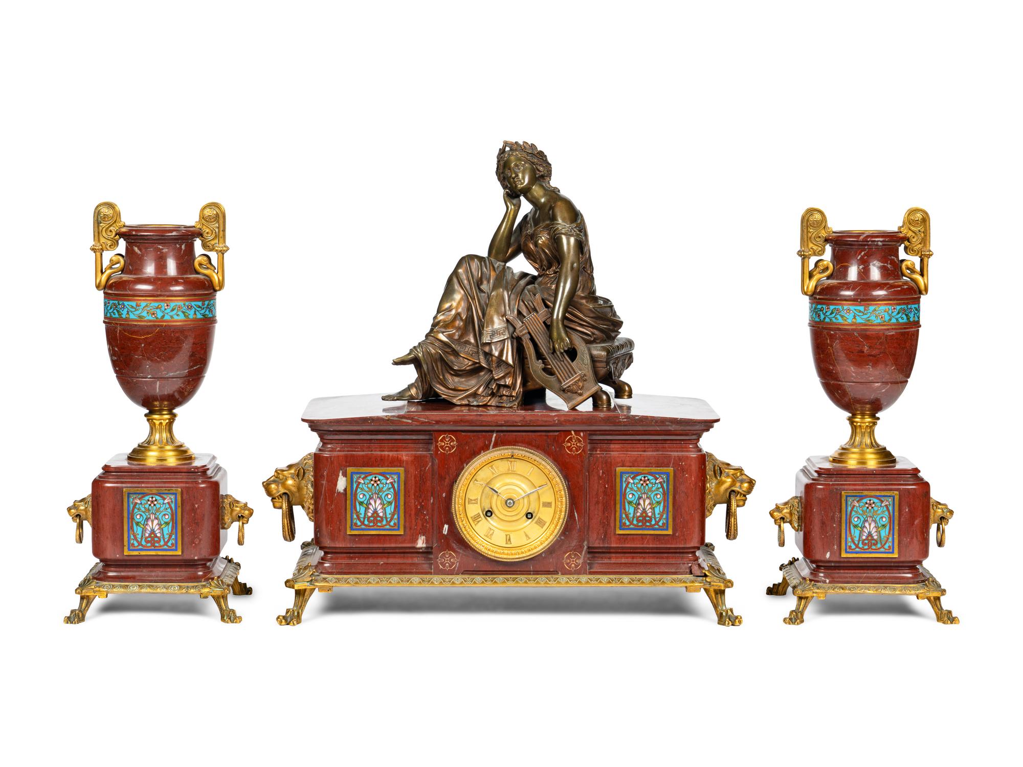A French Bronze, Marble and Champlevé Clock Garniture