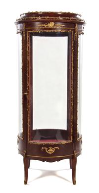 A Louis XVI Style Gilt Bronze Mounted Mahogany Vitrine, Height 64 1/2 x diameter 27 inches.